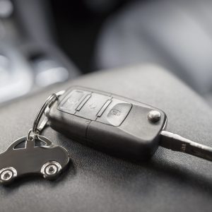 Car shape keyring and remote control key in vehicle interior